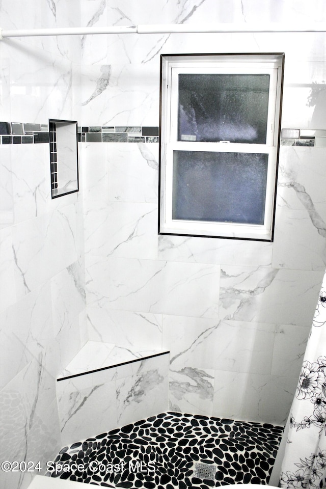 139 W Laila Dr W, Melbourne, FL 32904 - bathroom featuring a marble finish shower