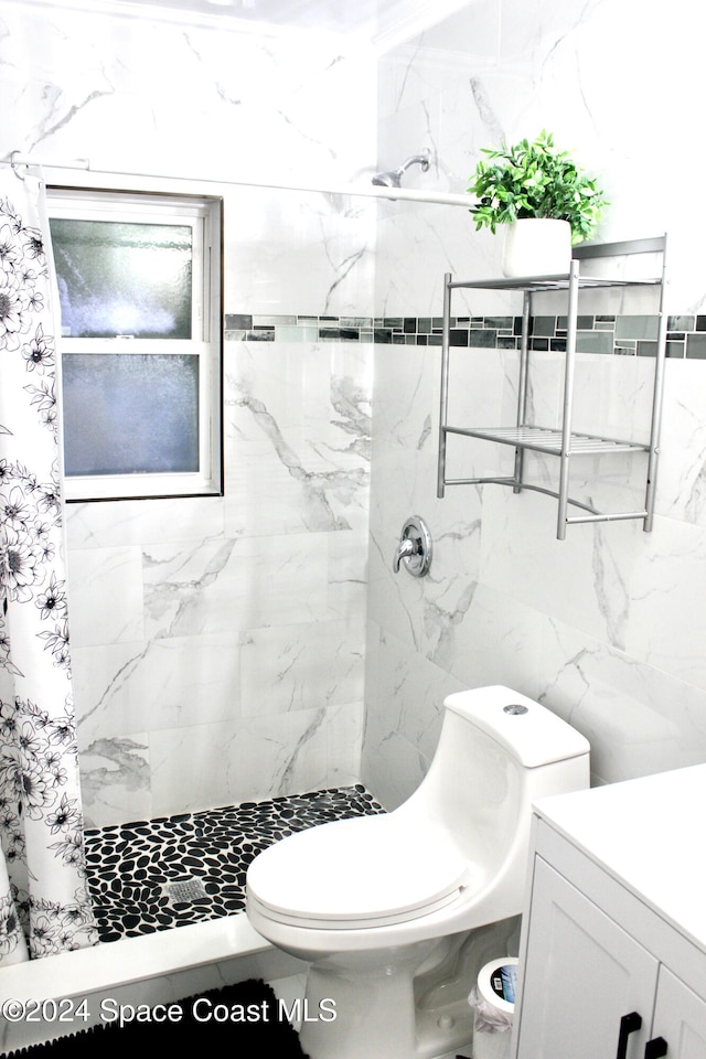 bathroom featuring walk in shower, tile walls, vanity, and toilet