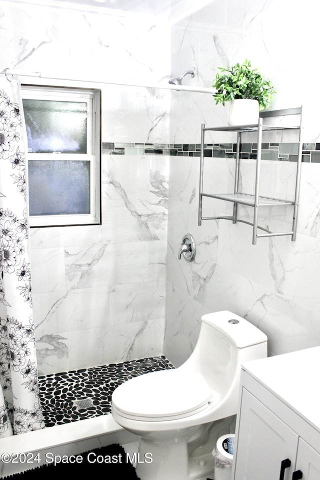 139 W Laila Dr W, Melbourne, FL 32904 - bathroom with a stall shower, vanity, toilet, and tile walls