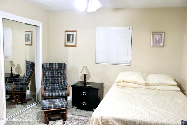 bedroom with carpet flooring and a closet