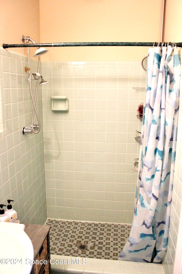 bathroom with a shower with curtain