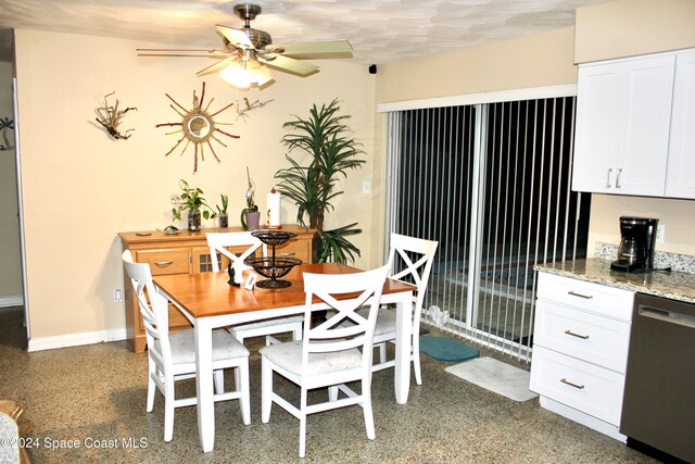 dining room featuring ceiling fan and a textured ceiling