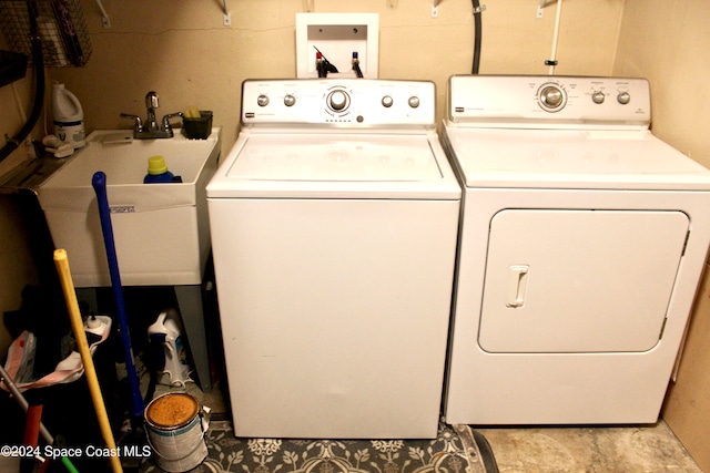 laundry room with separate washer and dryer