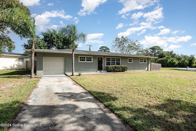 ranch-style home featuring a garage and a front yard