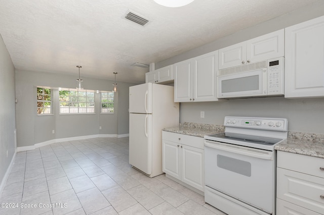 kitchen featuring white cabinets, a textured ceiling, light tile patterned floors, white appliances, and decorative light fixtures