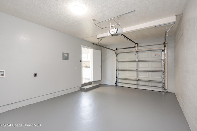 garage featuring a garage door opener and electric panel