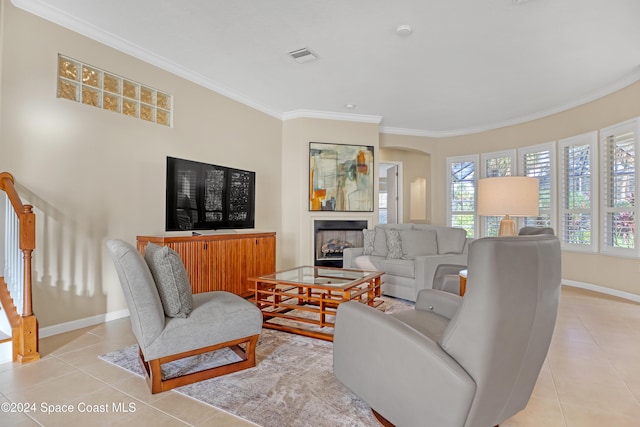 tiled living room featuring crown molding