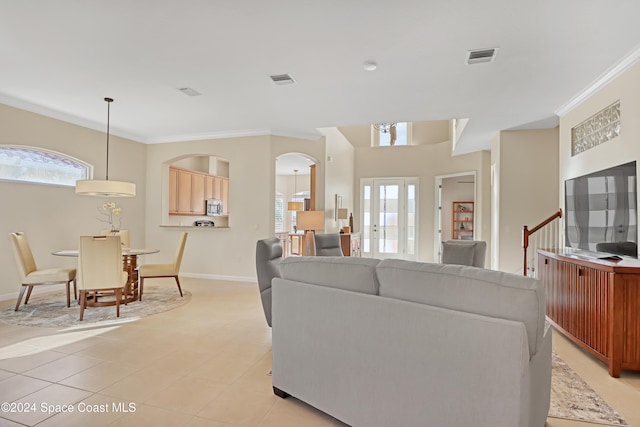 tiled living room featuring crown molding