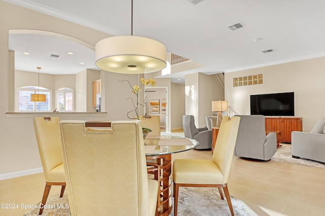 dining area with ornamental molding