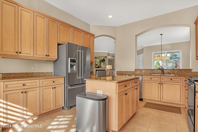 kitchen featuring stainless steel appliances, light tile patterned flooring, sink, hanging light fixtures, and crown molding