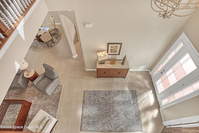 entrance foyer featuring a high ceiling and light tile patterned floors