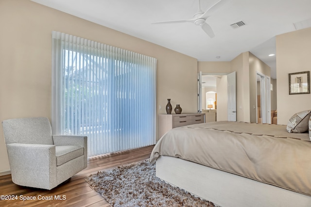 bedroom with wood-type flooring and ceiling fan