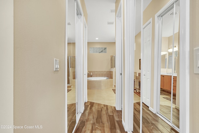 hallway featuring hardwood / wood-style flooring