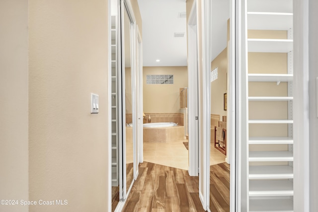 hallway featuring wood-type flooring