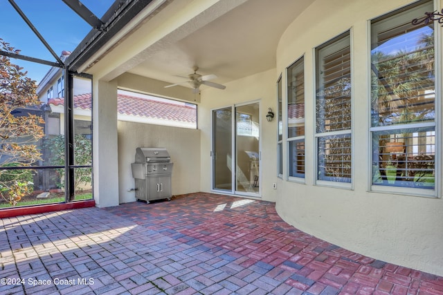 unfurnished sunroom featuring plenty of natural light and ceiling fan