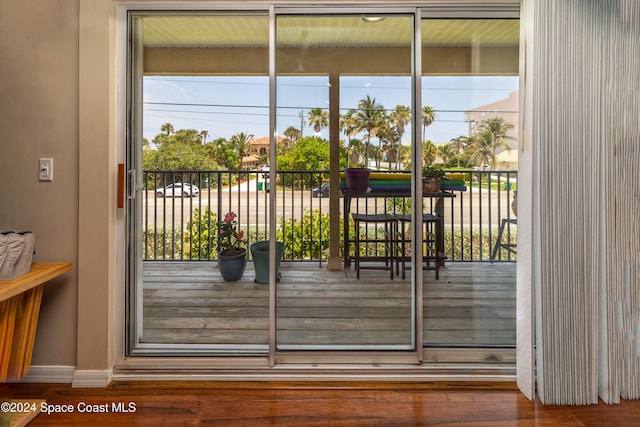 entryway with hardwood / wood-style flooring