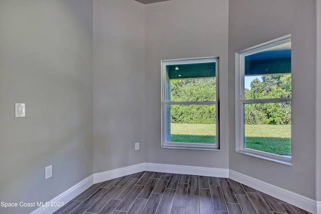 empty room featuring dark hardwood / wood-style floors