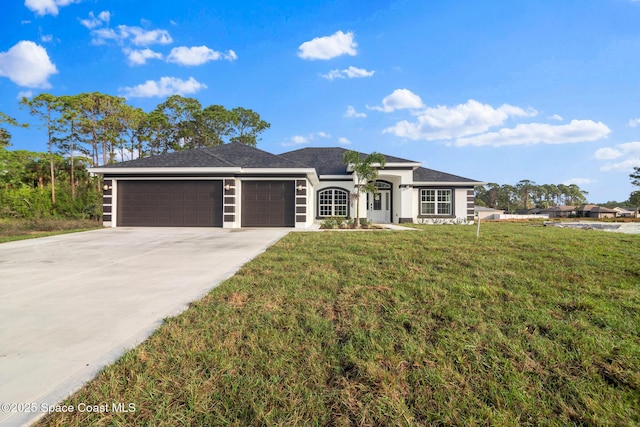 ranch-style home featuring a garage and a front yard