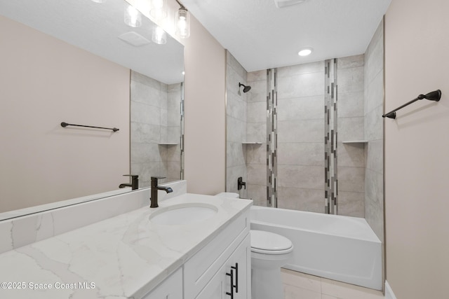 full bathroom with tiled shower / bath combo, vanity, and toilet