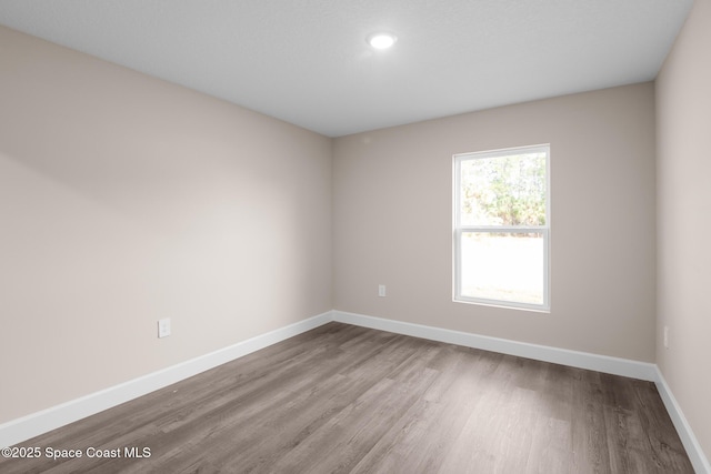 empty room featuring hardwood / wood-style floors