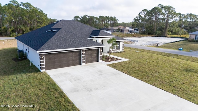 view of front facade with a garage and a front yard