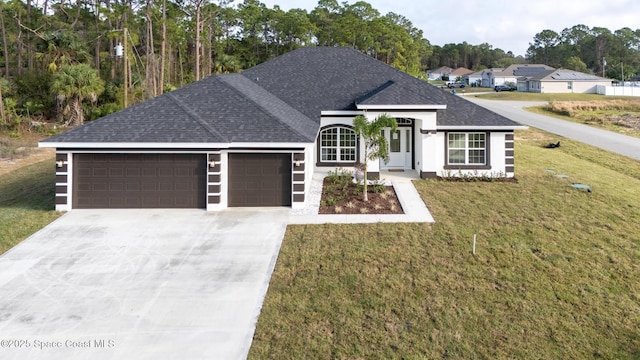 ranch-style house with a garage and a front yard