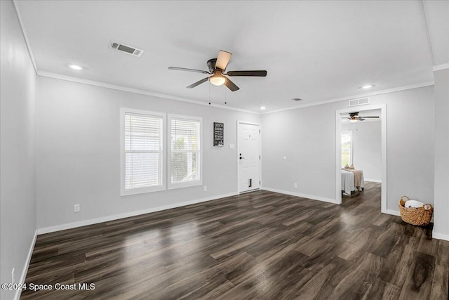 unfurnished living room featuring ceiling fan, dark hardwood / wood-style floors, and crown molding