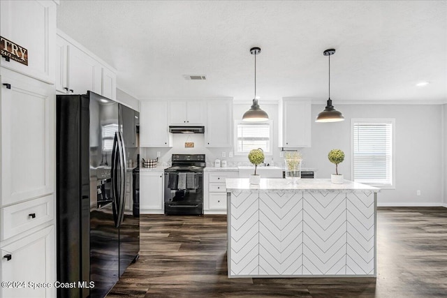 kitchen with black appliances, a center island, white cabinets, pendant lighting, and dark hardwood / wood-style flooring