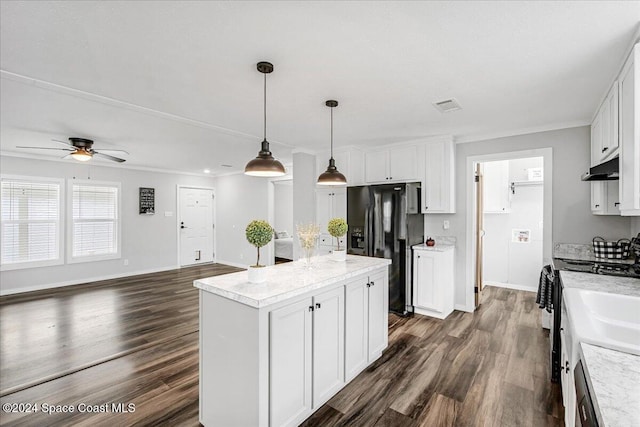 kitchen featuring black refrigerator with ice dispenser, dark hardwood / wood-style floors, a kitchen island, white cabinets, and pendant lighting