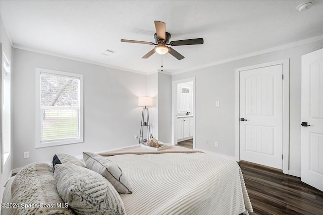 bedroom with ensuite bathroom, ceiling fan, dark hardwood / wood-style floors, a textured ceiling, and crown molding