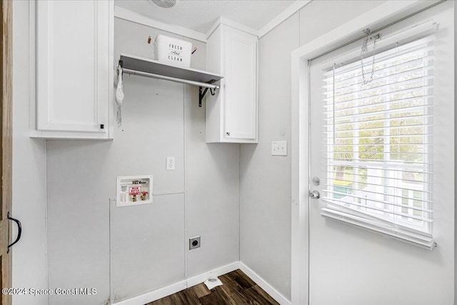 washroom featuring cabinets, hookup for a washing machine, hookup for an electric dryer, and dark hardwood / wood-style flooring