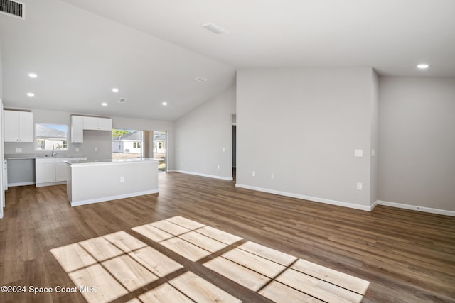 unfurnished living room featuring light wood-type flooring and vaulted ceiling