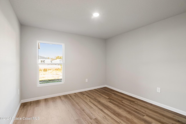 spare room with light hardwood / wood-style flooring