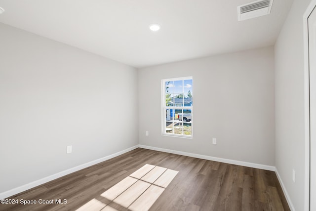 empty room featuring hardwood / wood-style flooring