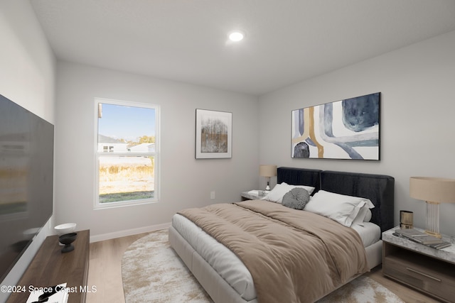 bedroom featuring light wood-type flooring