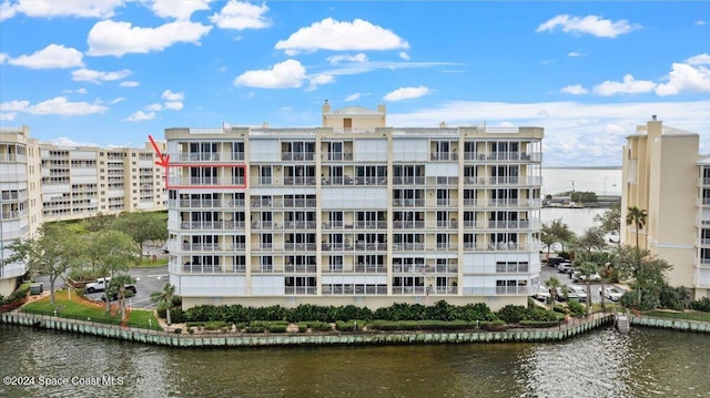 view of building exterior with a water view