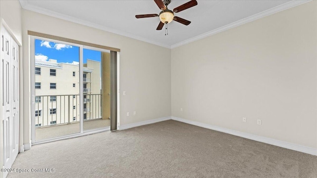 unfurnished room featuring carpet, ceiling fan, and crown molding