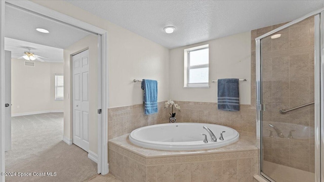 bathroom with independent shower and bath, a textured ceiling, and ceiling fan