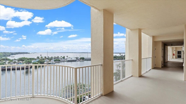 balcony featuring a water view