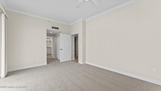 unfurnished bedroom featuring ceiling fan, ornamental molding, and light colored carpet