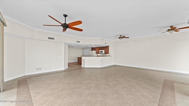 unfurnished living room featuring ornamental molding and light tile patterned floors