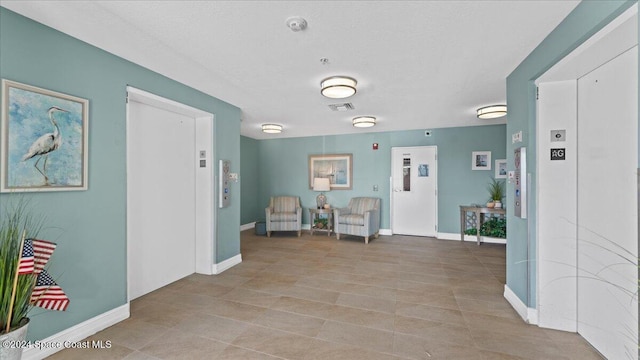 interior space featuring light tile patterned floors