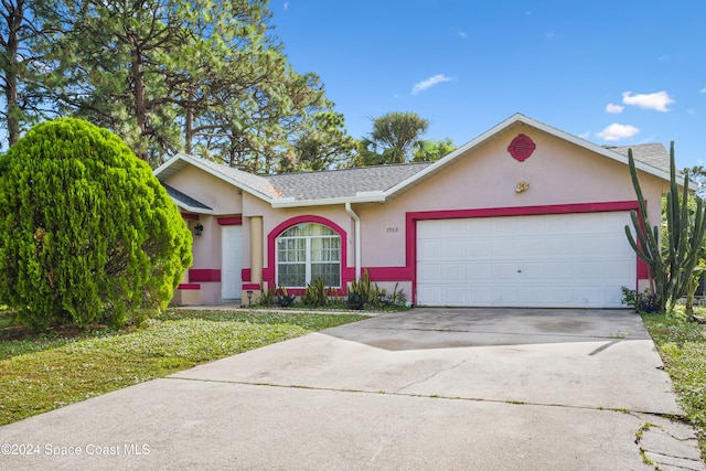 ranch-style house with a garage and a front yard