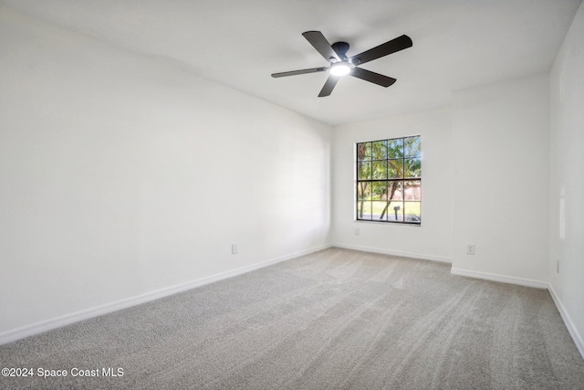 empty room with carpet flooring and ceiling fan