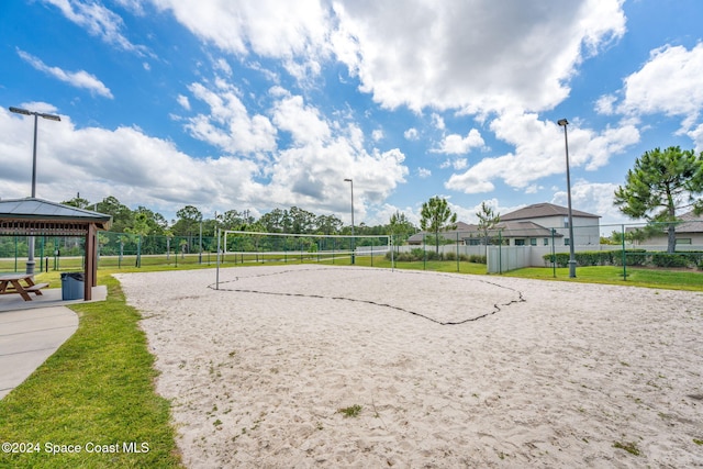 surrounding community with volleyball court, a yard, and a gazebo