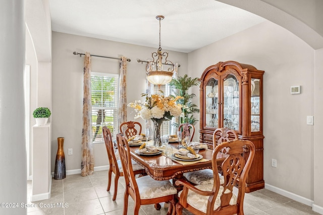 3540 Watergrass St, West Melbourne, FL 32904 - dining space featuring arched walkways, light tile patterned floors, baseboards, and a chandelier