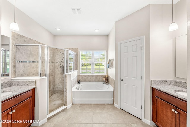 bathroom with shower with separate bathtub, vanity, and a healthy amount of sunlight