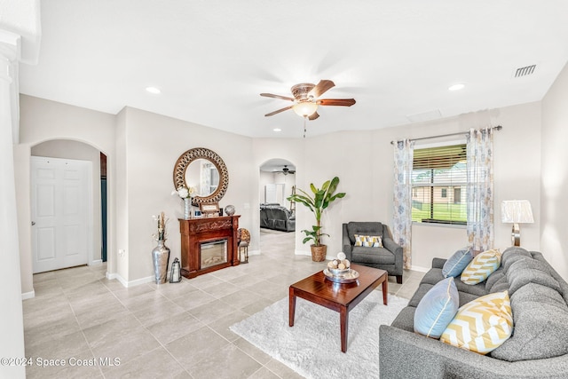 tiled living room featuring ceiling fan