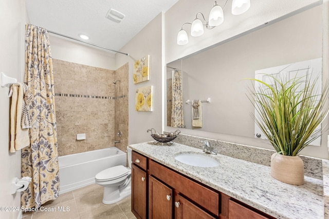 full bathroom with a textured ceiling, shower / bath combo with shower curtain, vanity, tile patterned floors, and toilet