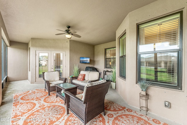 view of patio with french doors, ceiling fan, and an outdoor living space